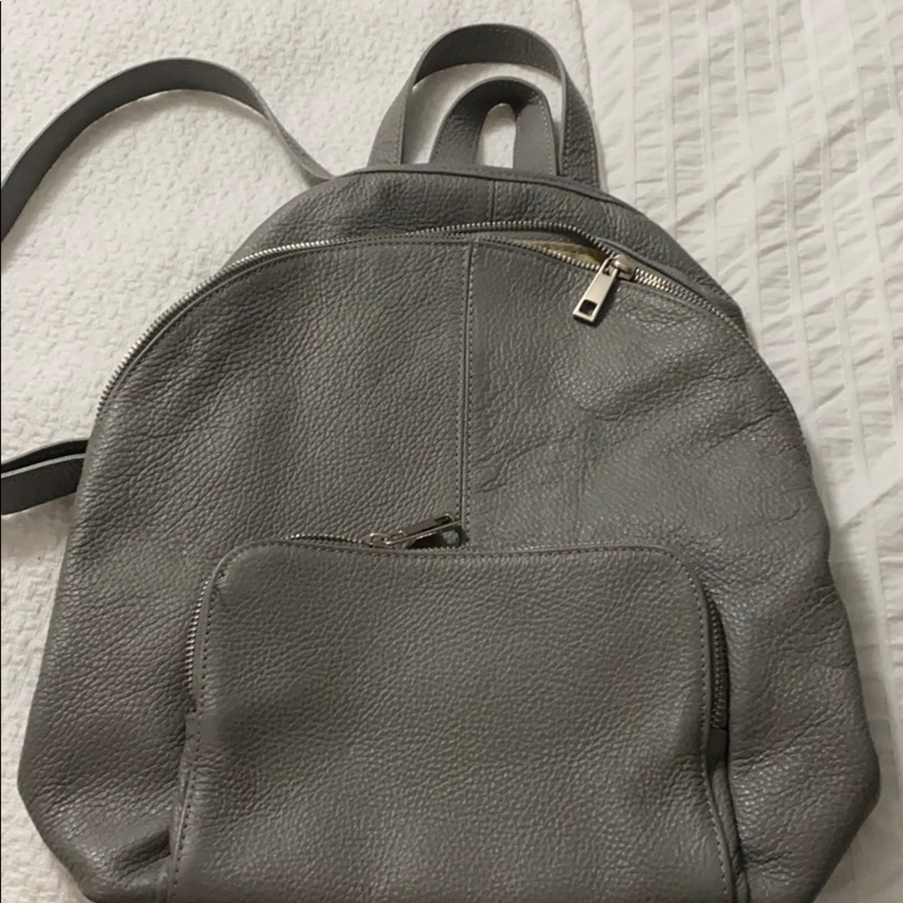 Medium size Italian leather gray backpack.